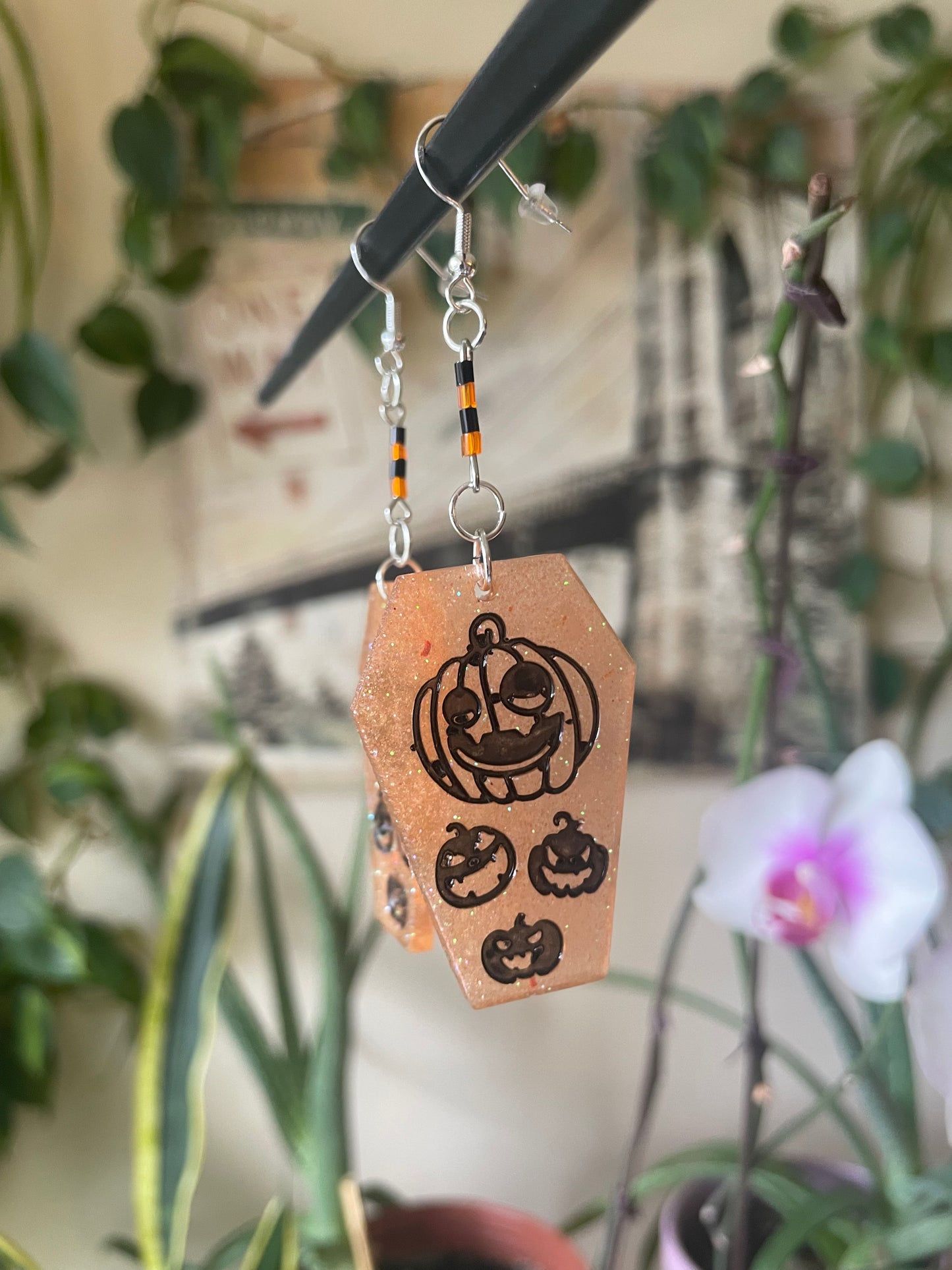Spooky themed imprinted epoxy resin coffin earrings