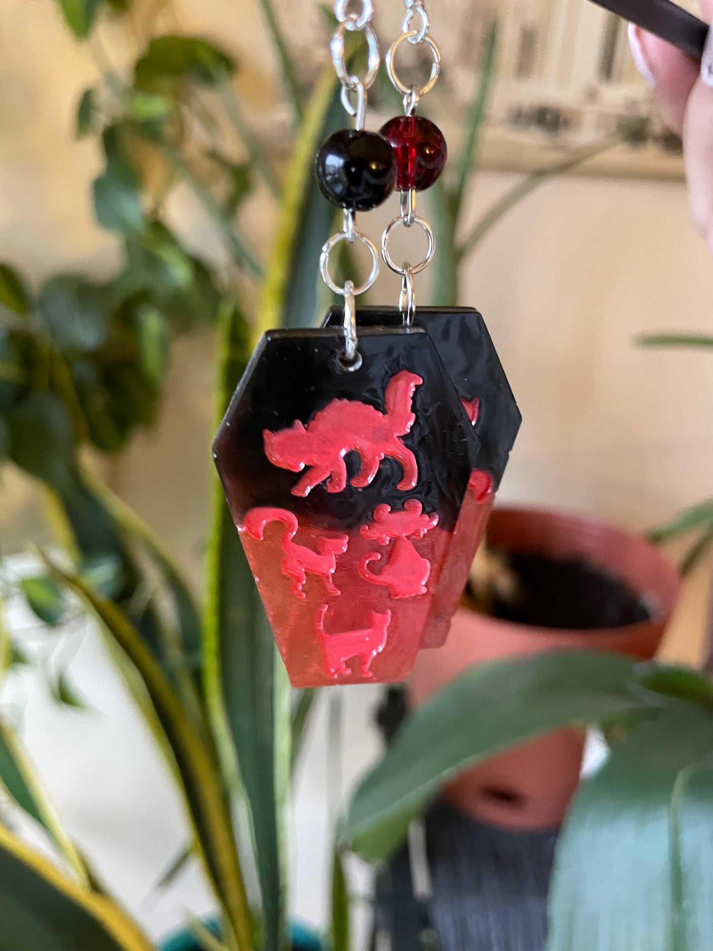 Spooky themed imprinted epoxy resin coffin earrings