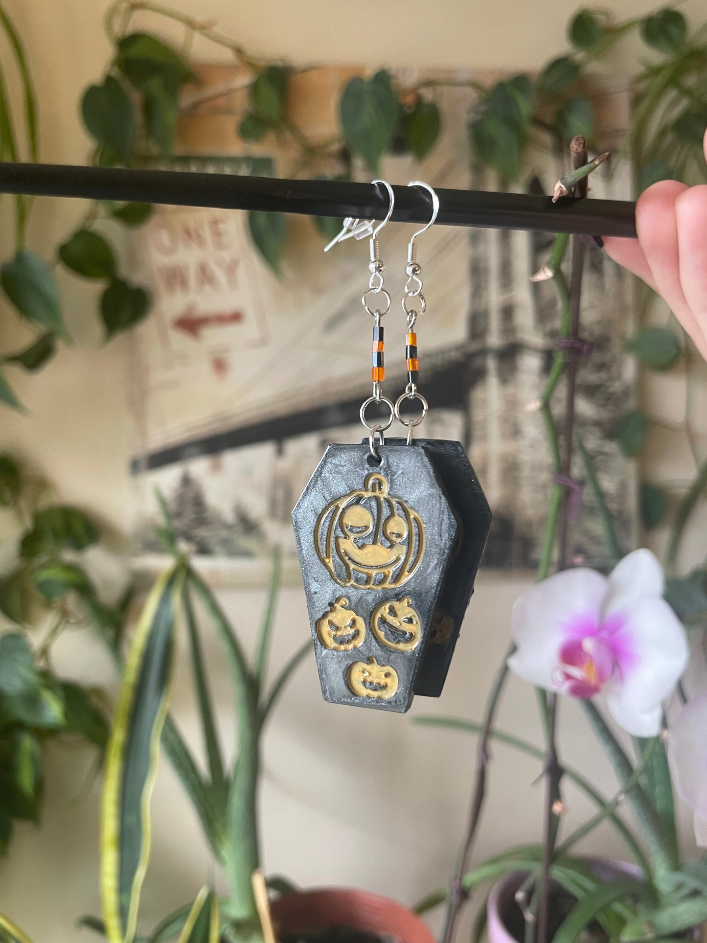 Spooky themed imprinted epoxy resin coffin earrings