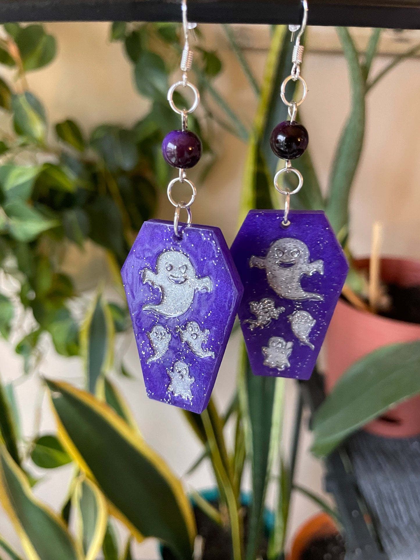 Spooky themed imprinted epoxy resin coffin earrings