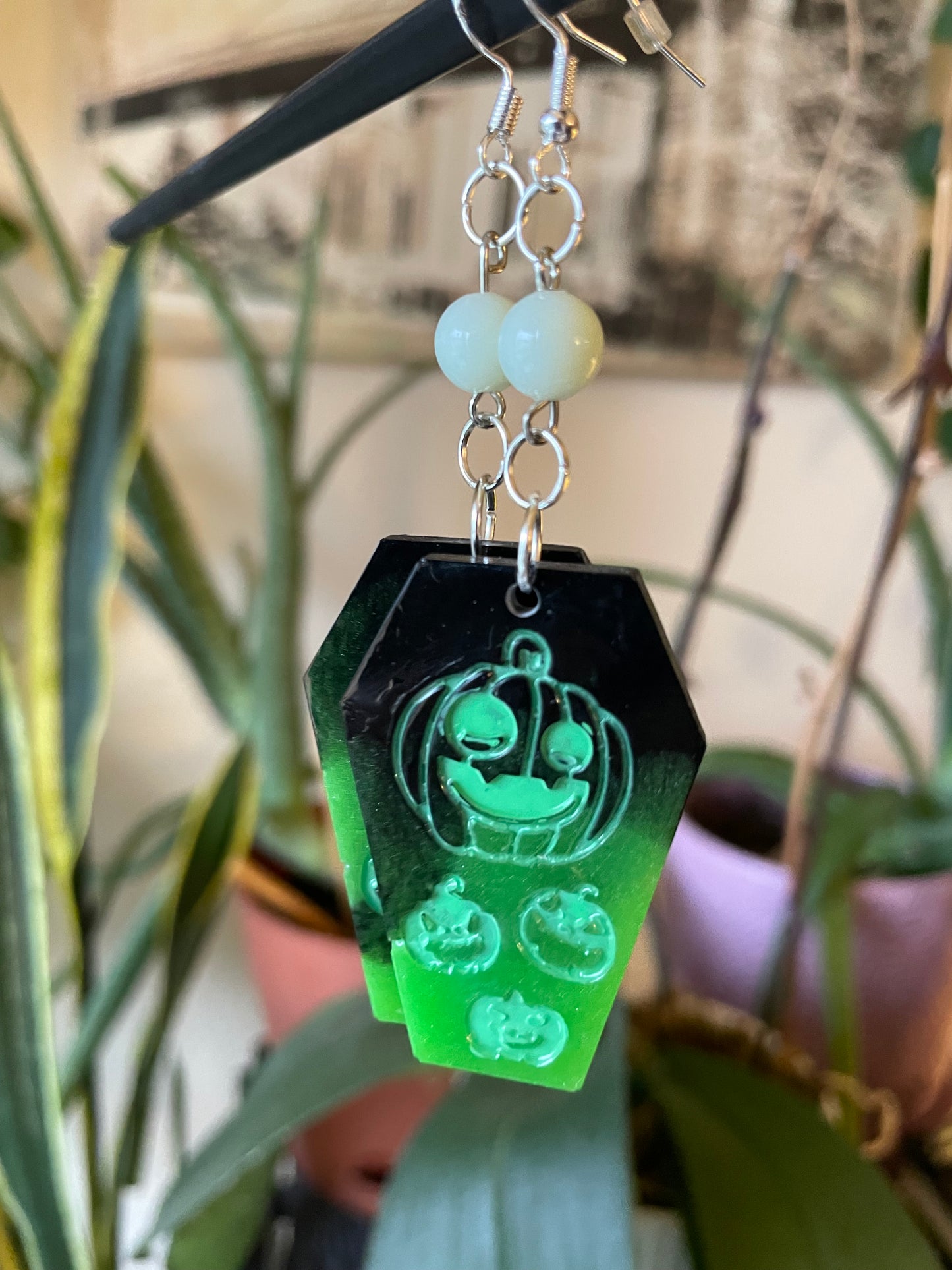 Spooky themed imprinted epoxy resin coffin earrings