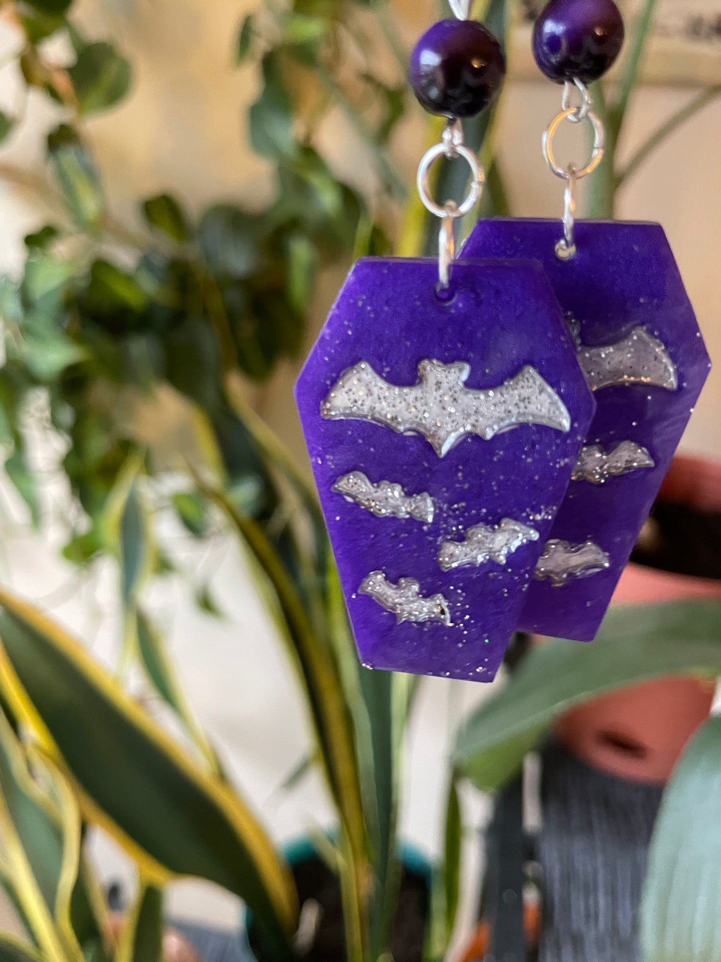 Spooky themed imprinted epoxy resin coffin earrings