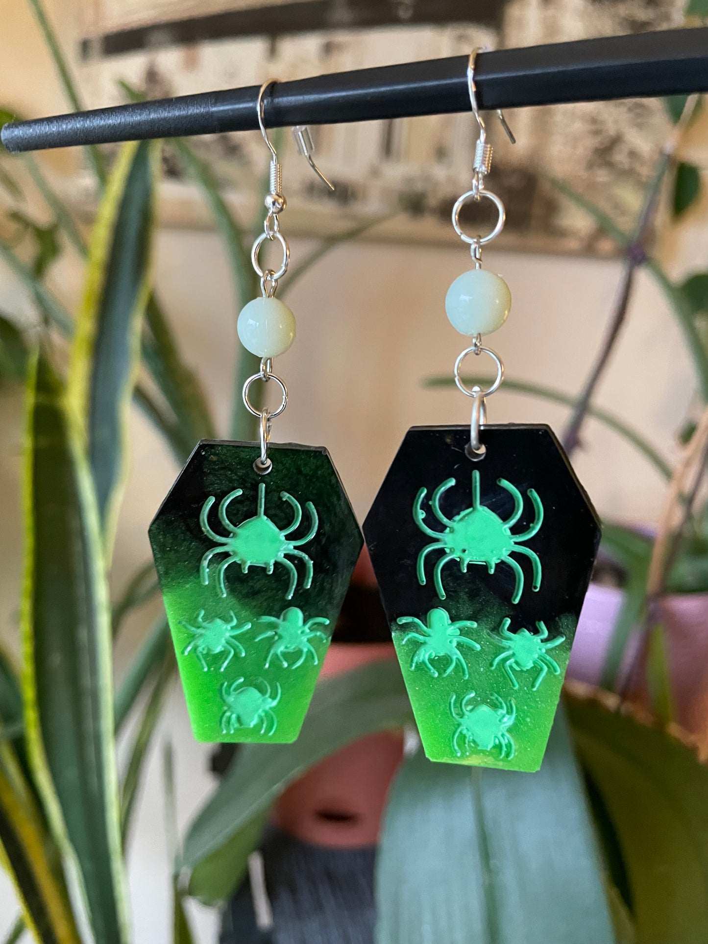 Spooky themed imprinted epoxy resin coffin earrings
