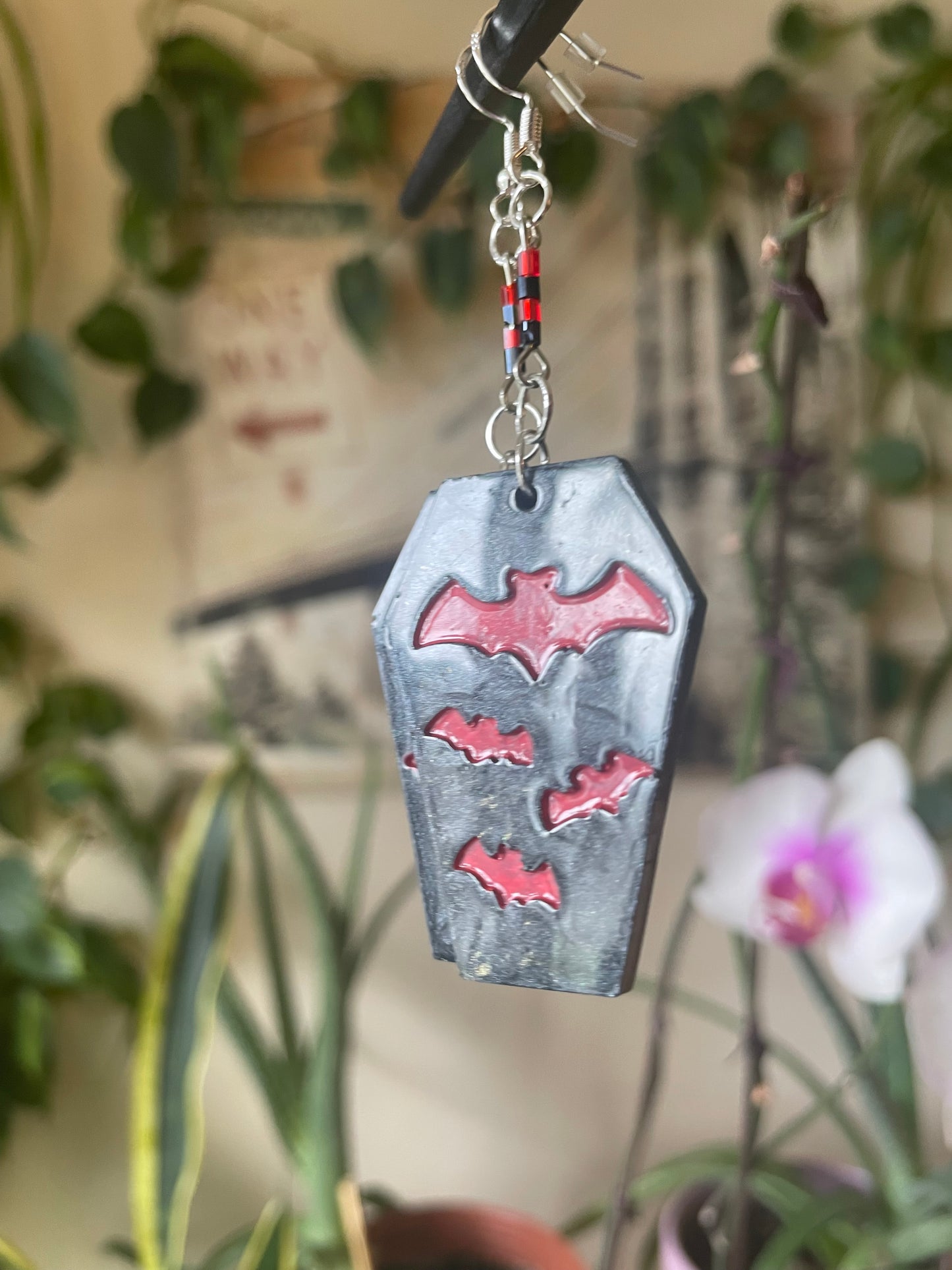 Spooky themed imprinted epoxy resin coffin earrings