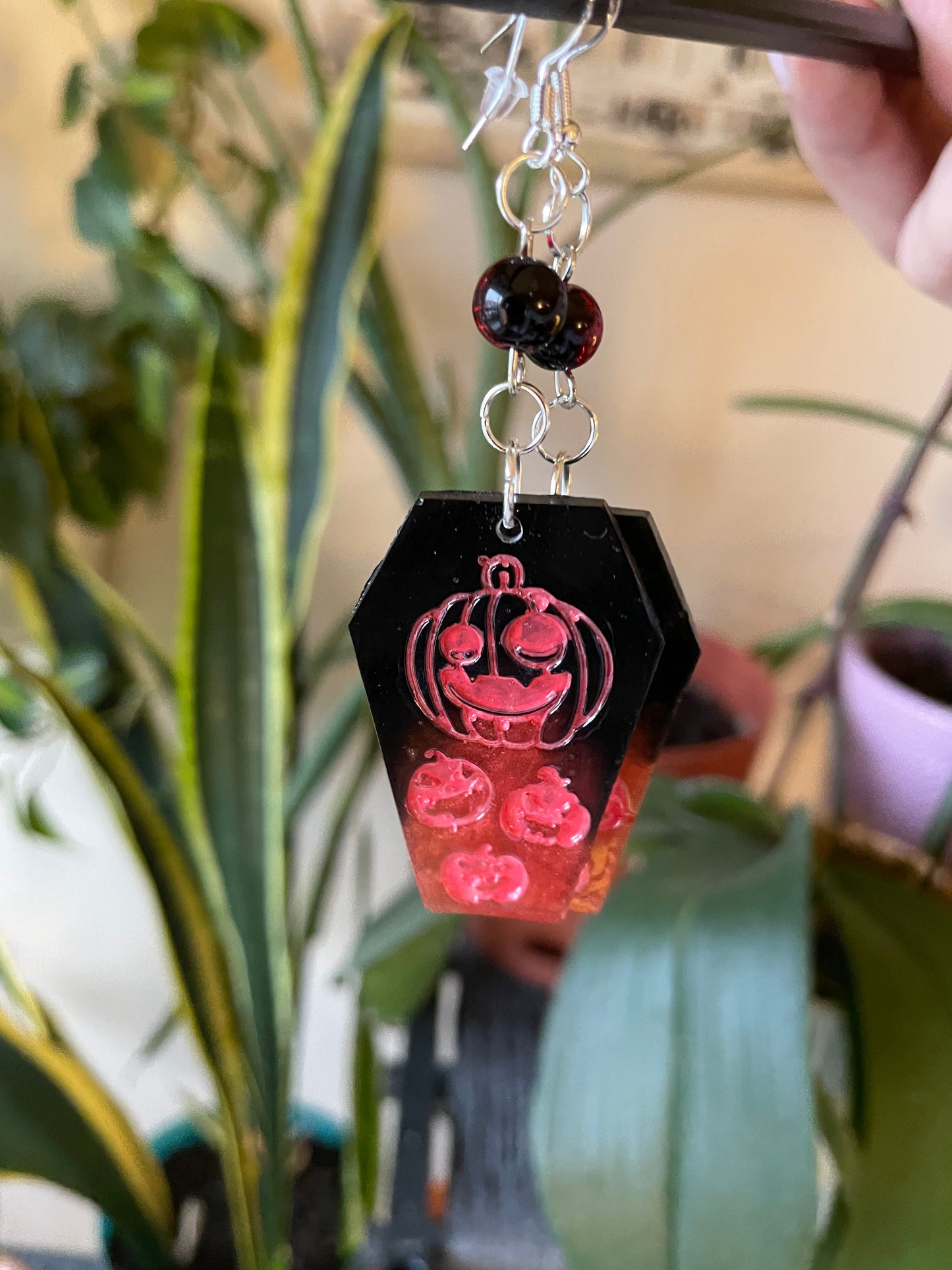 Spooky themed imprinted epoxy resin coffin earrings