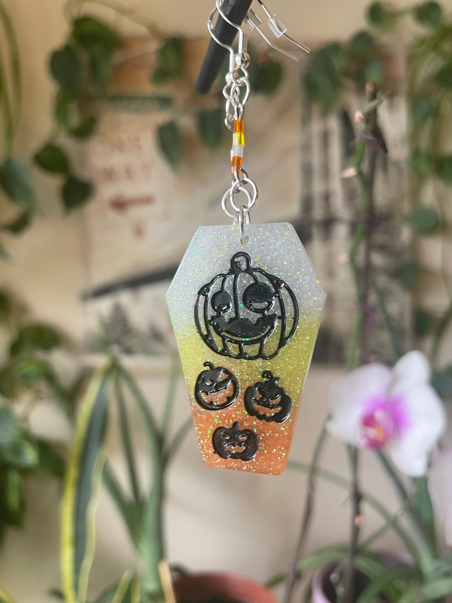 Spooky themed imprinted epoxy resin coffin earrings