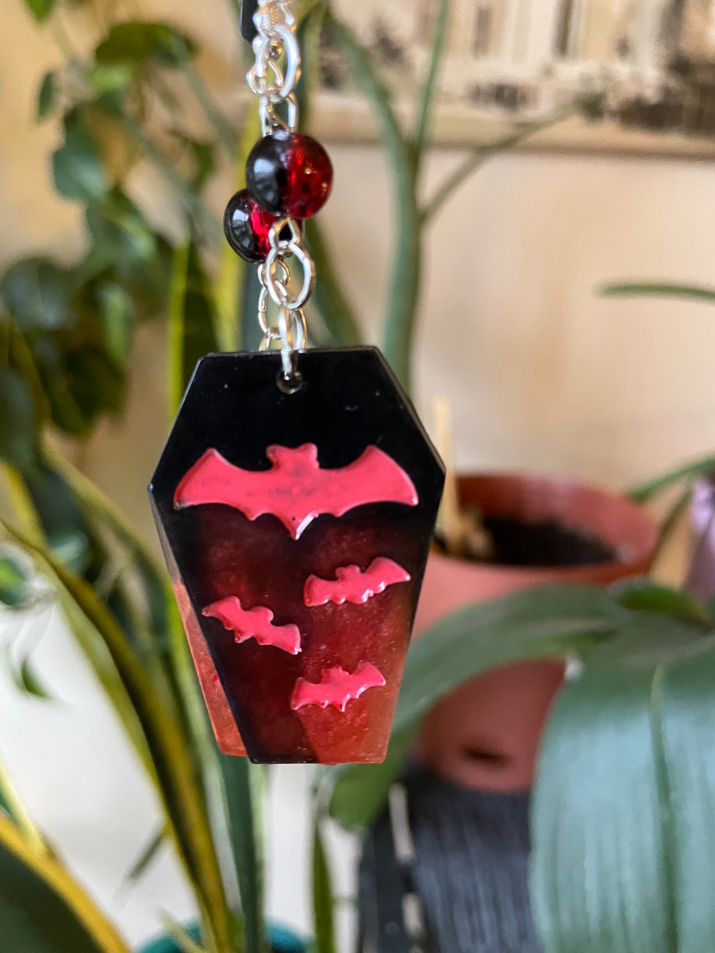 Spooky themed imprinted epoxy resin coffin earrings