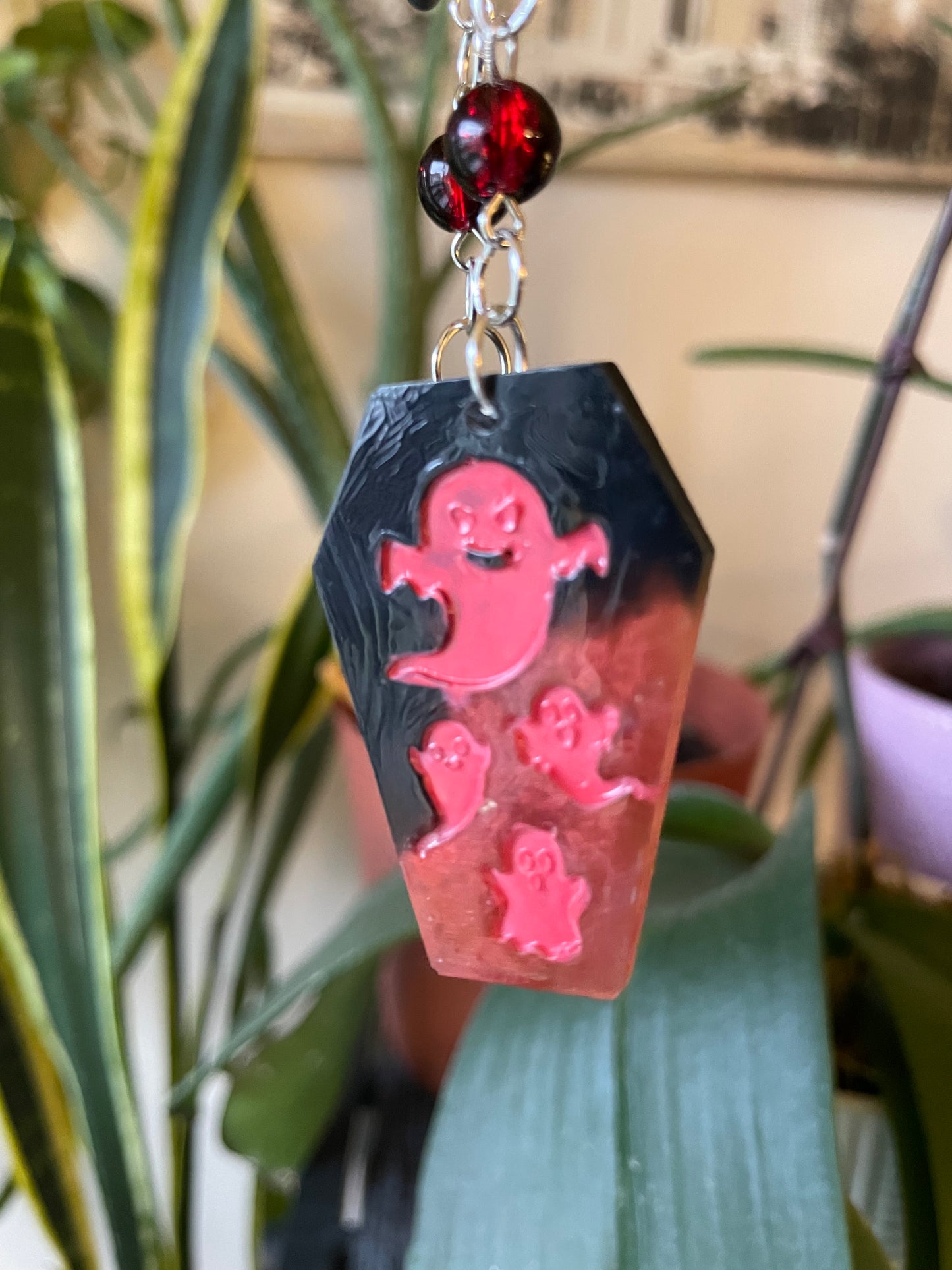 Spooky themed imprinted epoxy resin coffin earrings