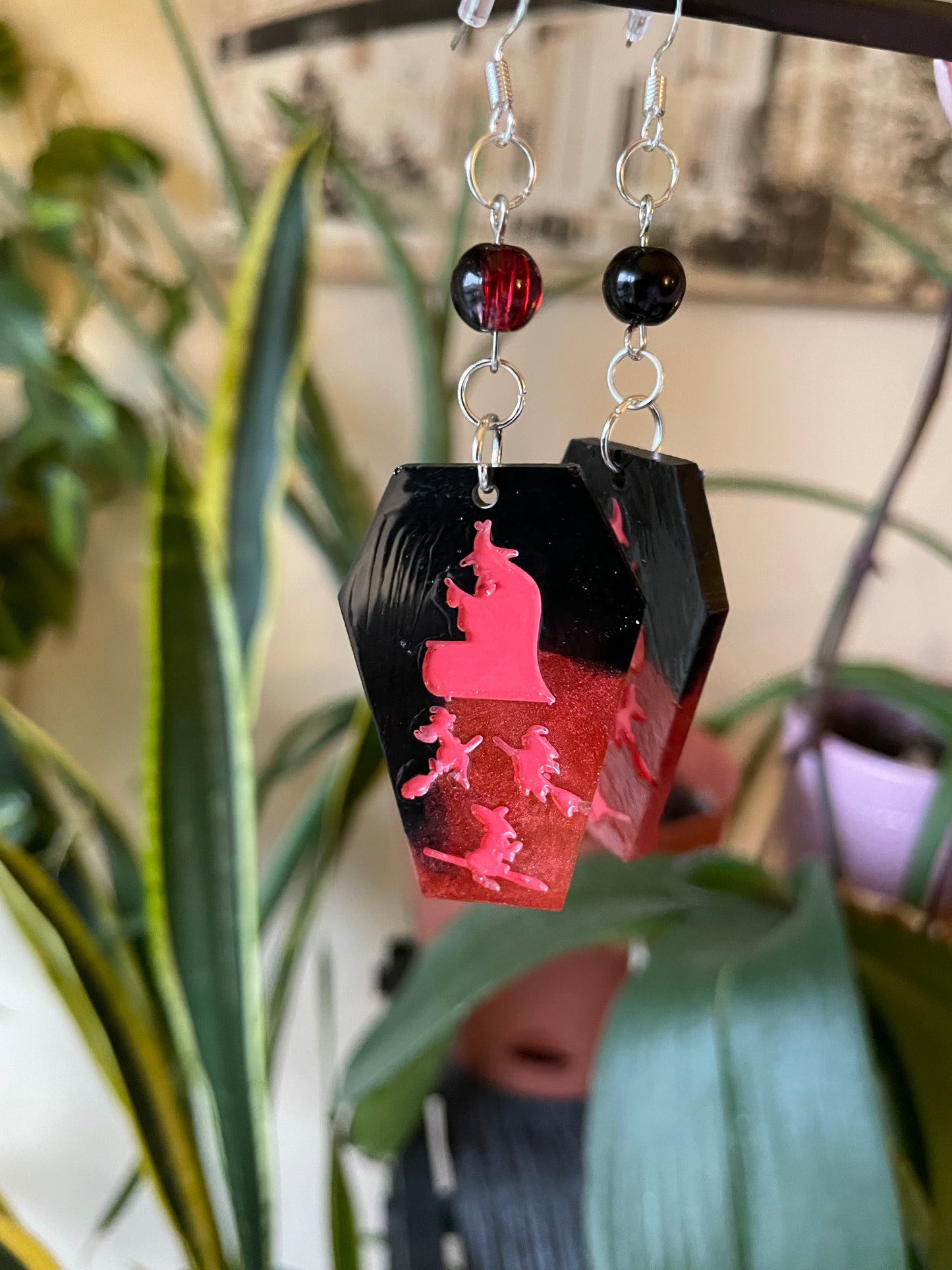 Spooky themed imprinted epoxy resin coffin earrings