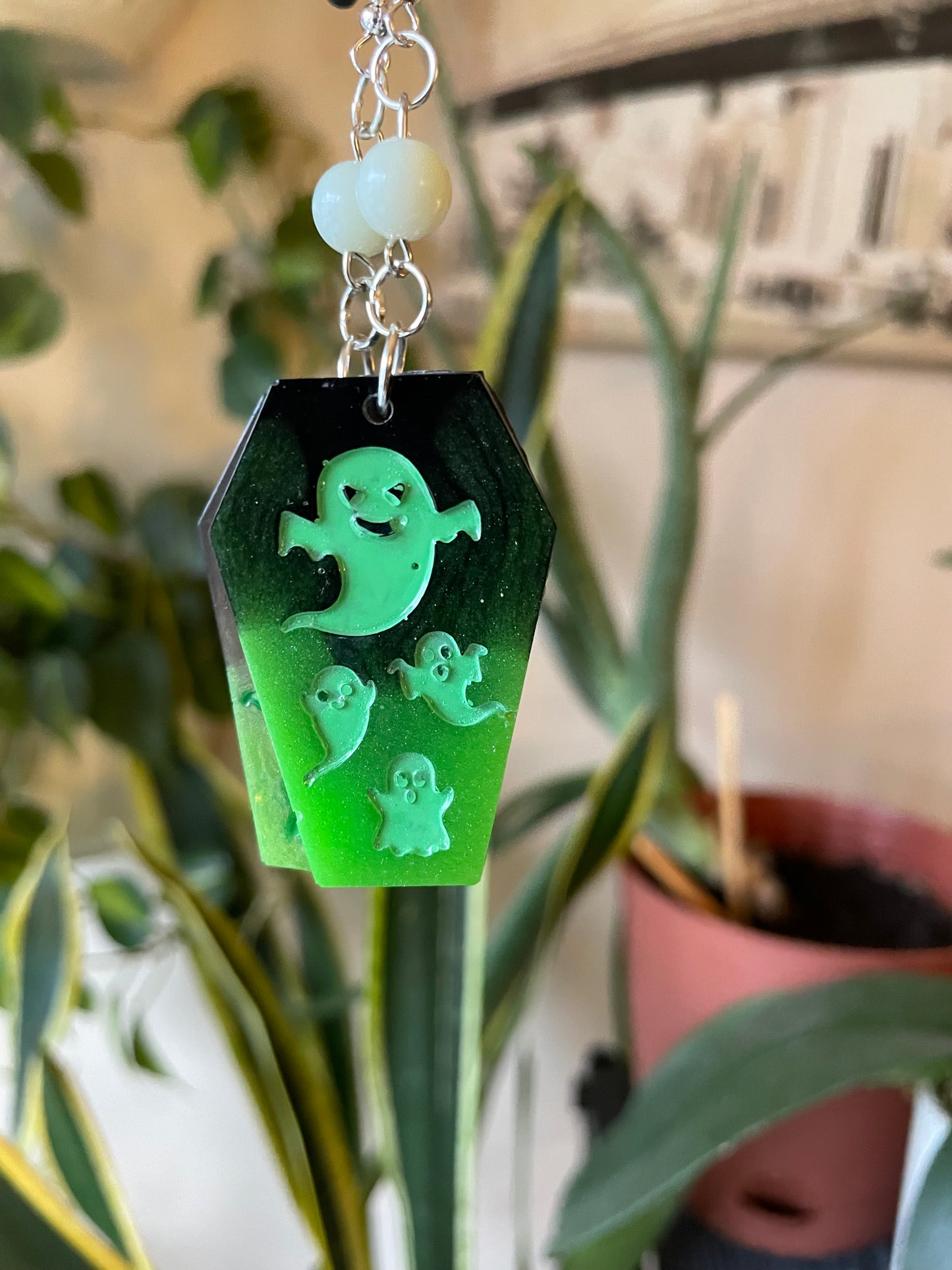 Spooky themed imprinted epoxy resin coffin earrings
