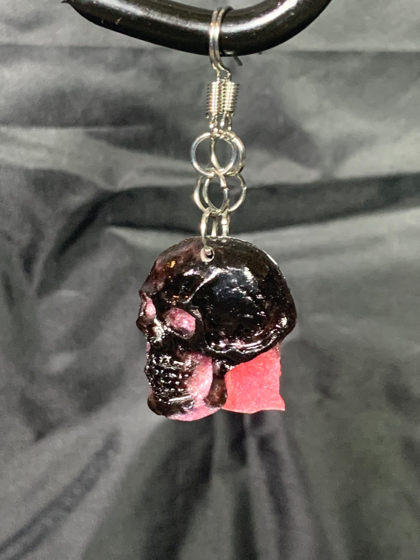 Pink and black epoxy resin skull earrings