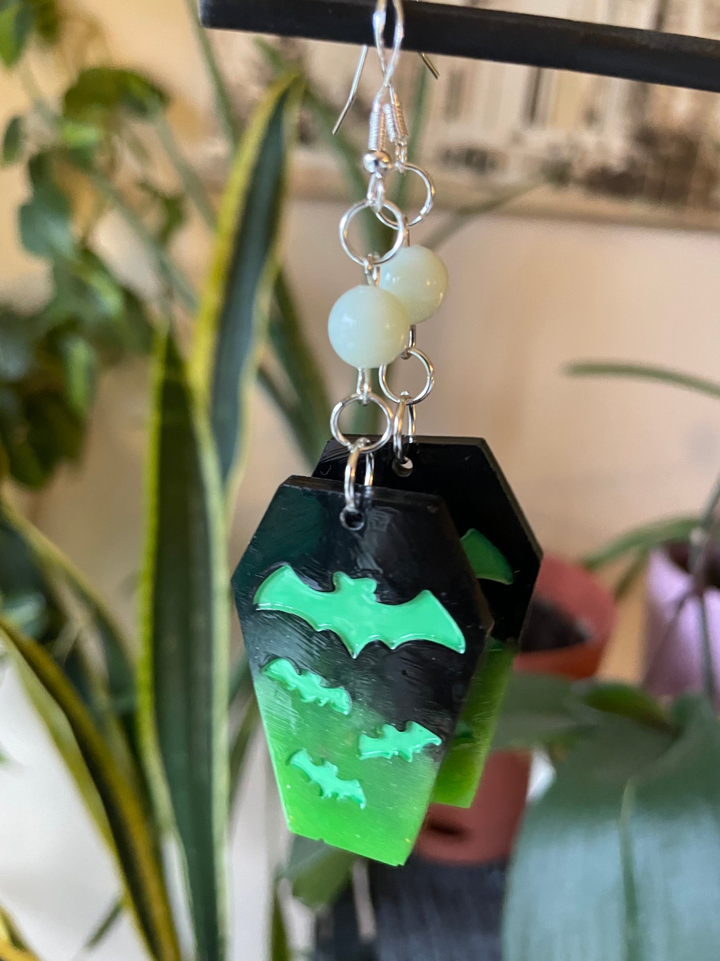 Spooky themed imprinted epoxy resin coffin earrings